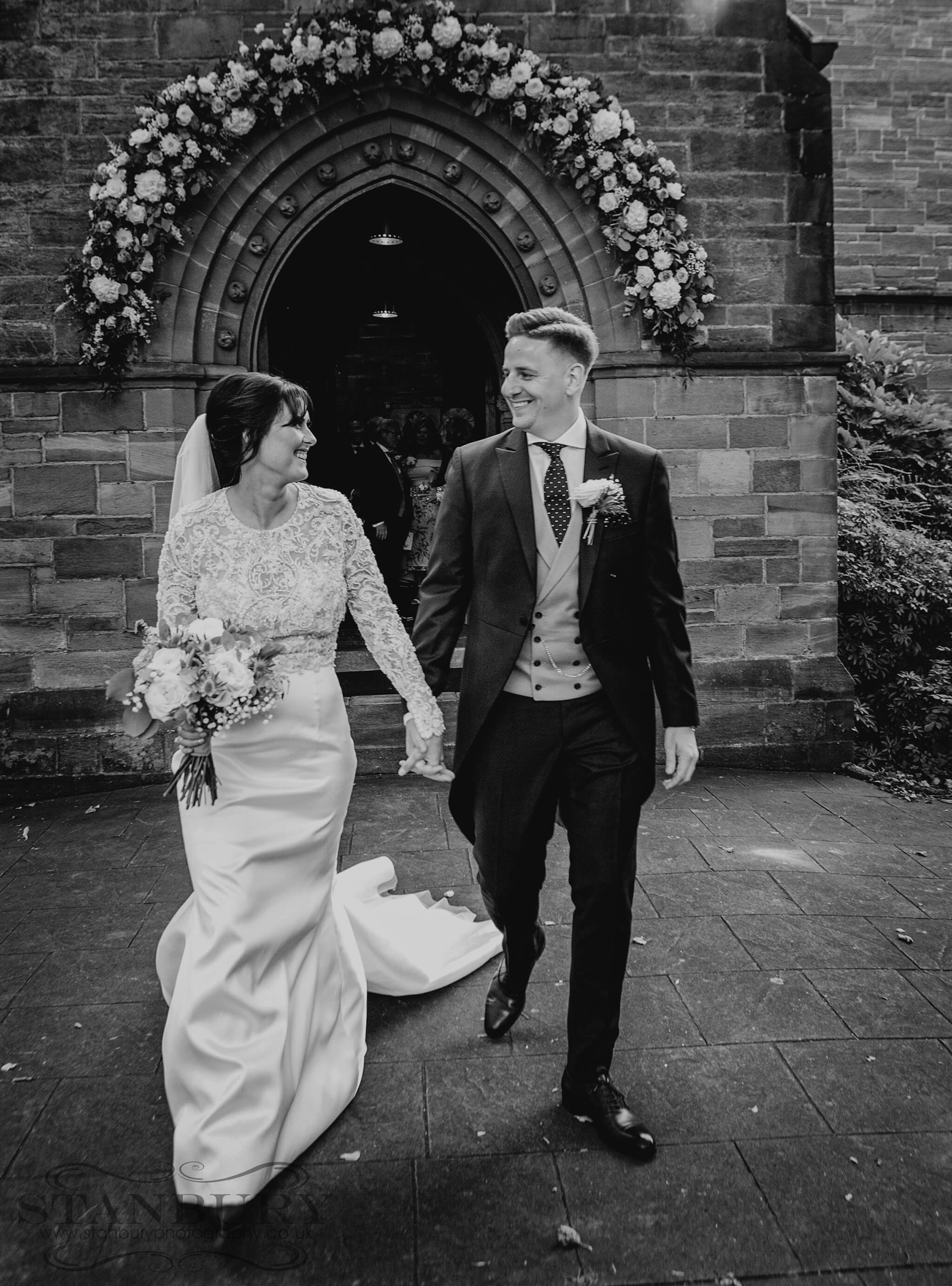 bride-groom-church-aisle-owen-house-wedding-barn-photography-stanbury